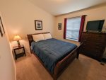 Guest bedroom with queen-size bed.